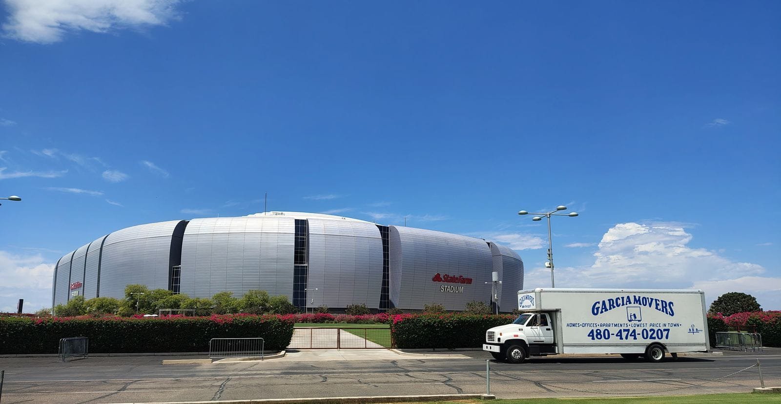 A Garcia Movers truck parked outside State Farm Stadium
